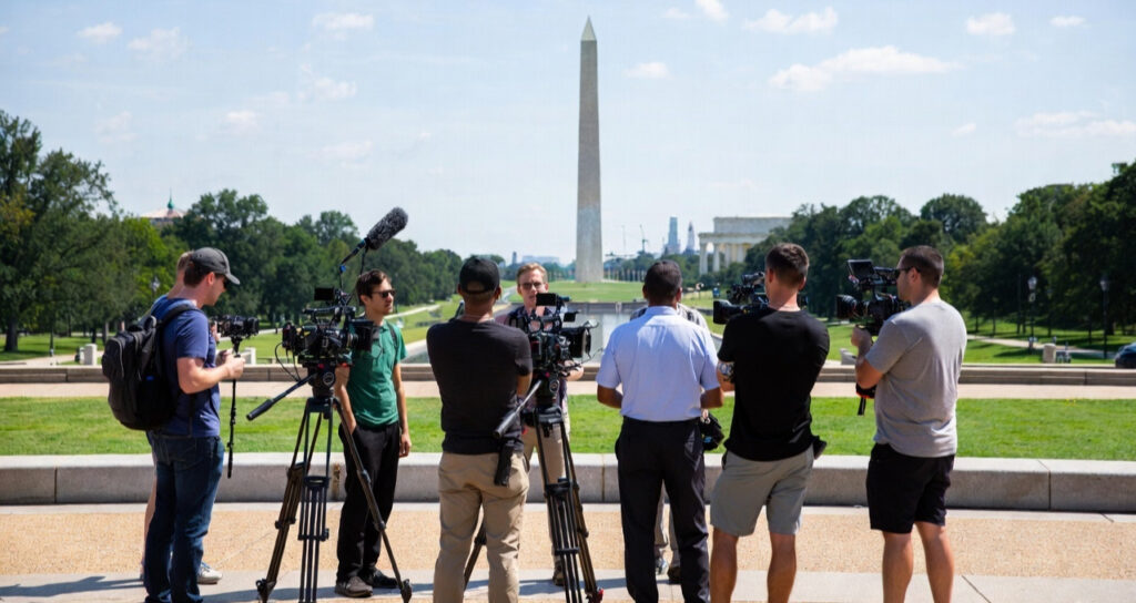 DMV Media setting up shot in front of Washington Monument.